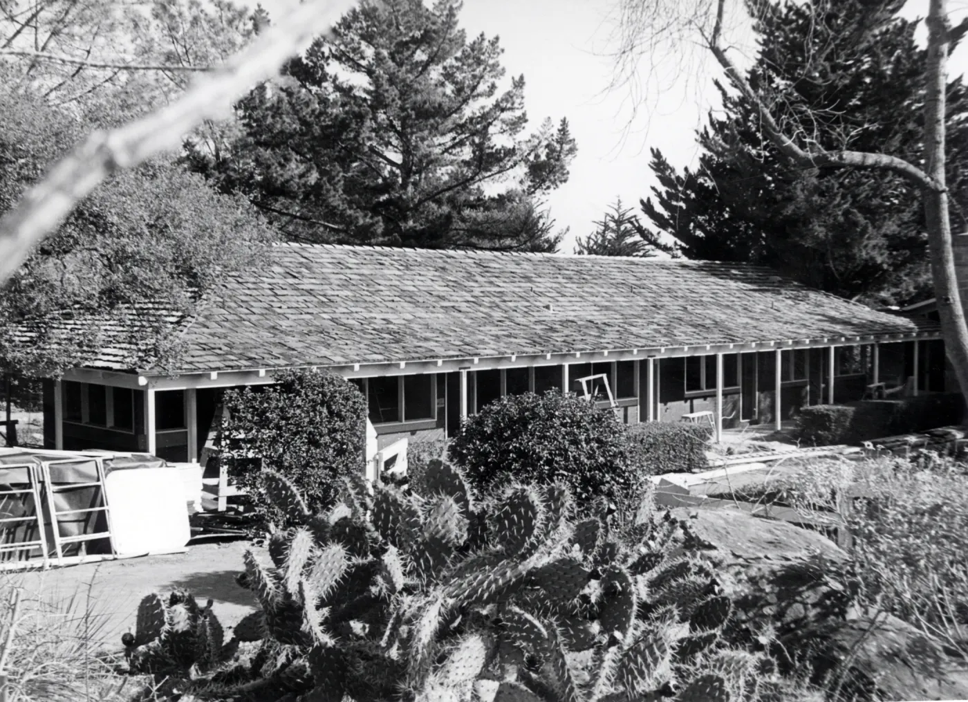 Early stages in the construction of a new building to house a public information office and laboratories on the upper level and seed and tool storage rooms below.