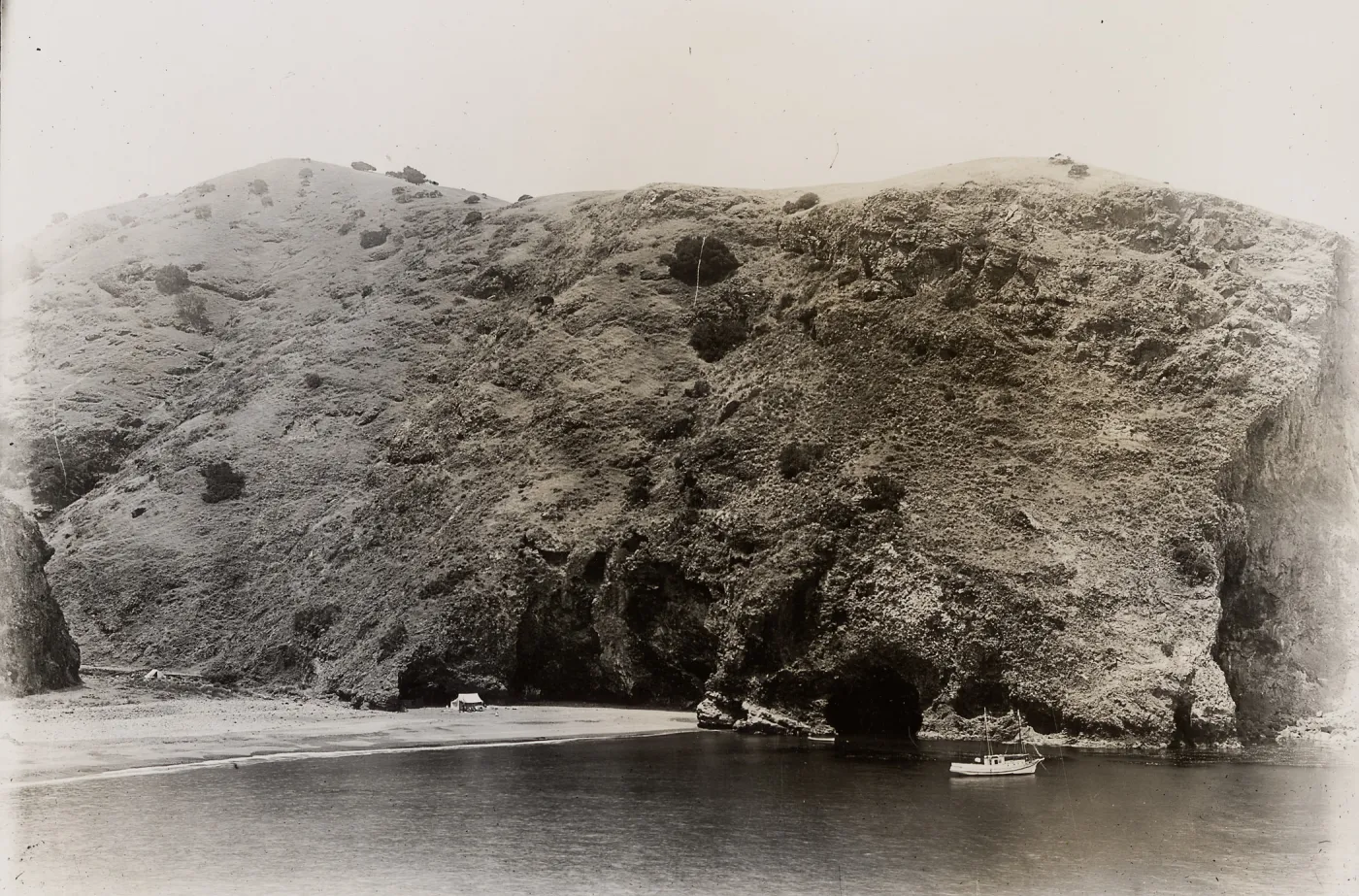 boat in harbor and tent camp on beach, Santa Cruz Island