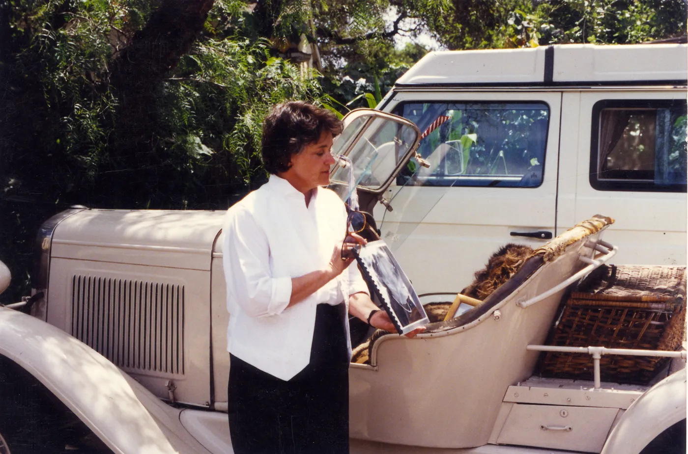 Sydney Baumgartner with picture of Elizabeth de Forest, car is Lockwood de Forest's â€˜Buffalo'