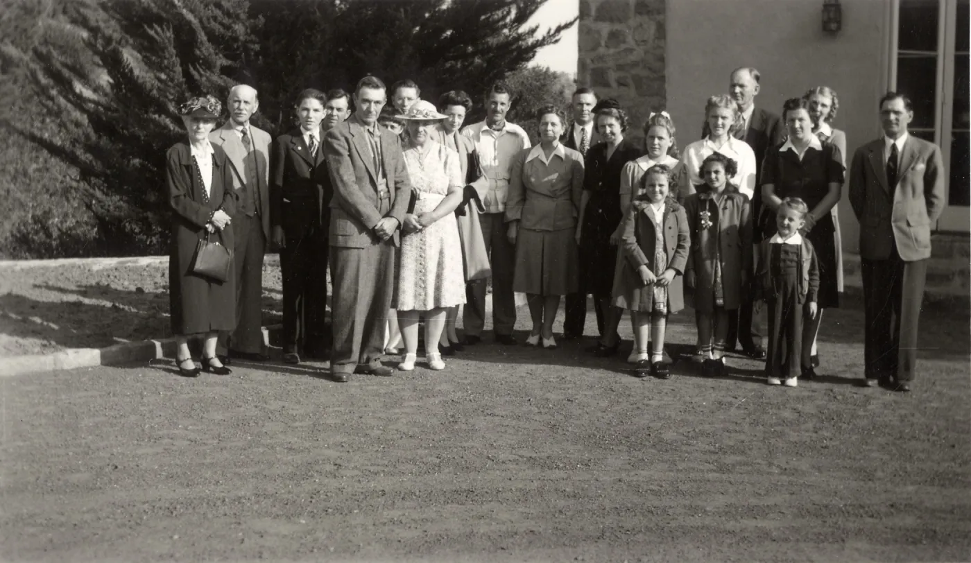 Staff Group Photo - left to right: Mr. & Mrs Doyle (long time helper); 4th from left - Stuart (lath house, green house foreman, lived here); 9th from left - secretary Betty Cross Norland; 11th from left - secretary; 12th from left - Van R; right -John Ba
