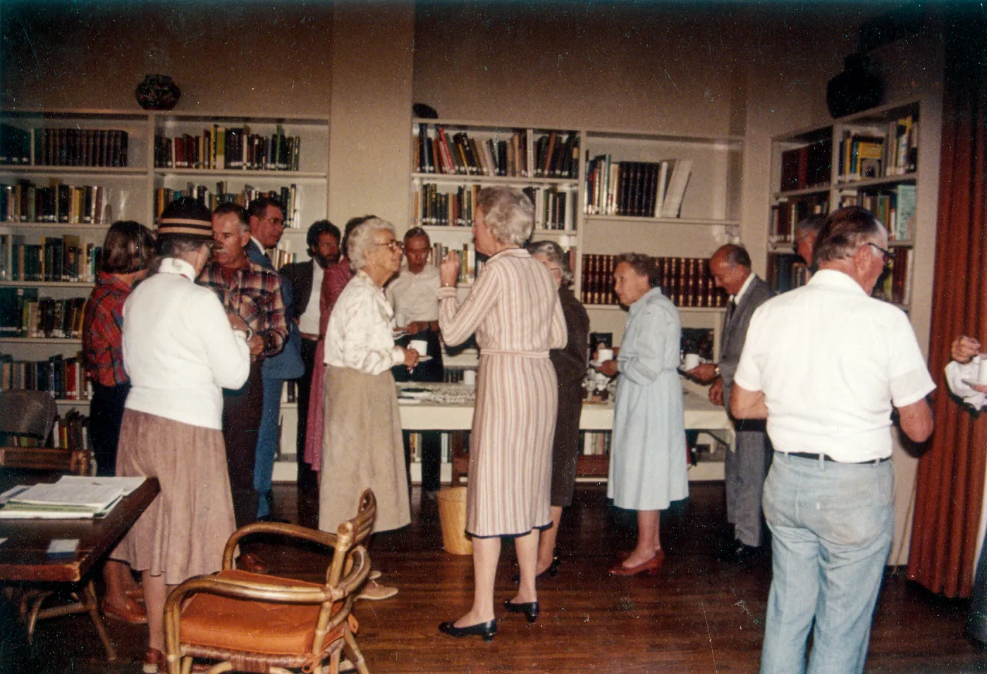 Man in plaid shirt facing camera: Dick Broder. Woman left of Mrs. Eaton (center): Elizabeth Tilt. Woman right of Mrs. Eaton in blue dress: Mrs. Elizabeth de Forest. Behind Mrs de Forest & Paul Koylas & man far right to camera: Bruce van Dyk
