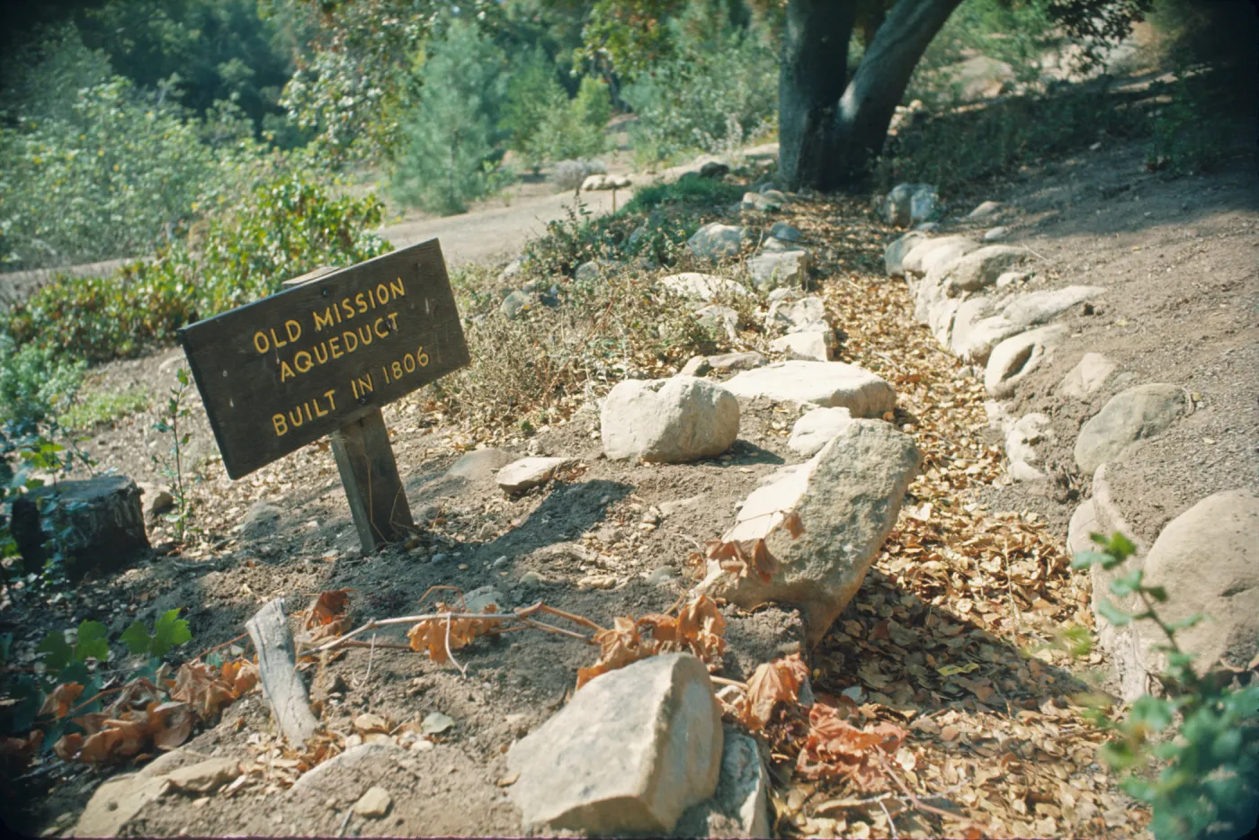 'Old Mission Aqueduct, built in 1806' wood sign