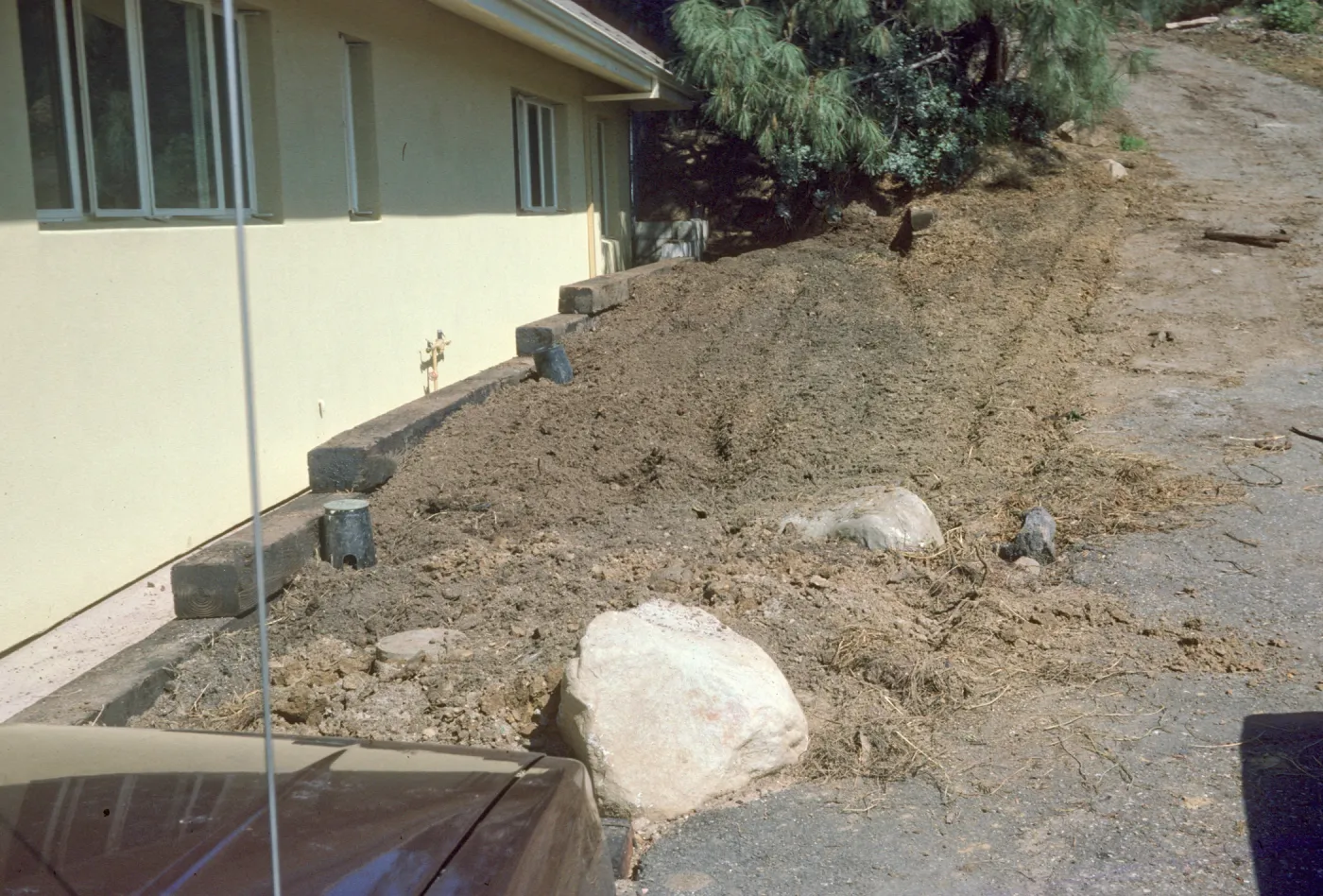Construction: wall complete E. side of can yd before wall added