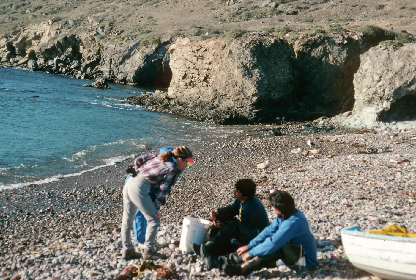 West San Benito Island, Debbie Bronson w/fishermen at village