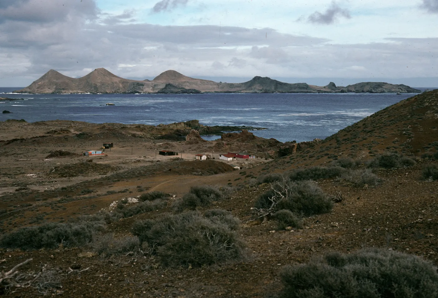 West San Benito Island, village & view of East San Benito Island