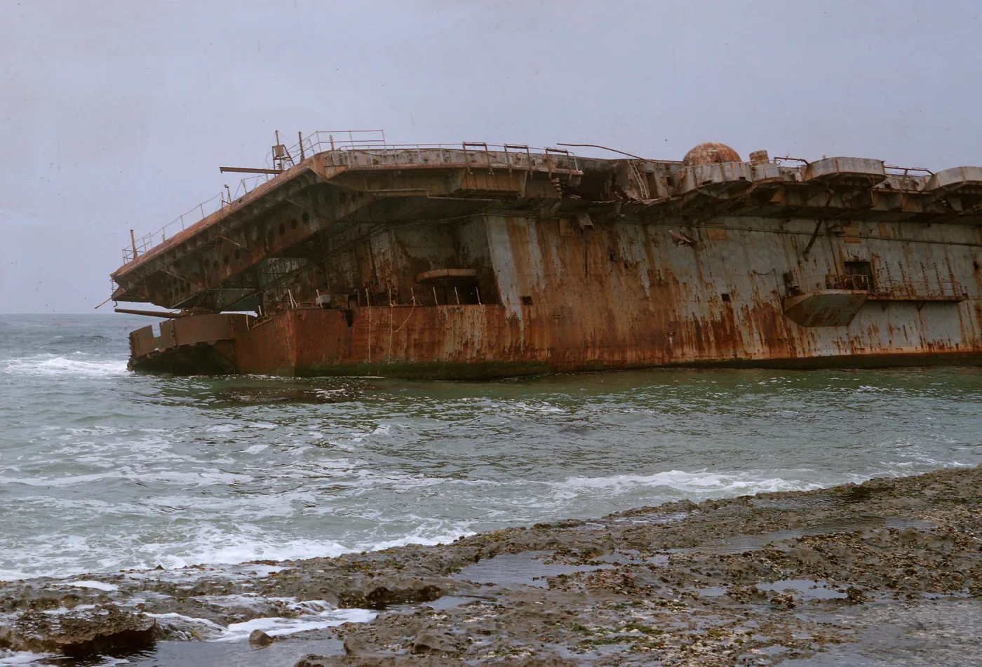 14/ rear end of aircvraft carrier aground on reef, 65-179 & SN-94