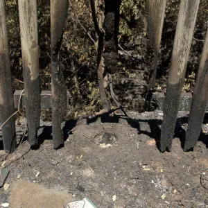 burned fence above drop-off to Mission Dam after the Jesusita Fire