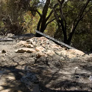 burned remains of the Home Demonstration deck, adjacent to the cottage, after the Jesusita Fire