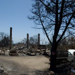 burned vehicles parked at the Gane House site, after the Jesusita Fire