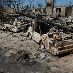 burned vehicles at the Gane House site, after the Jesusita Fire