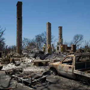 firefighters put out a hot spot at the Gane House site, after the Jesusita Fire