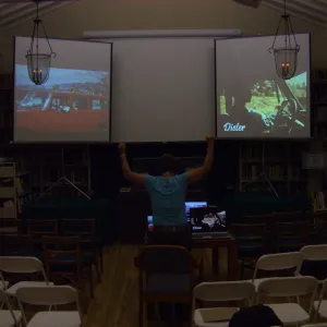 Preparing multimedia show for party celebrating Bob Haller's 80th year, three screens