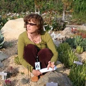 Betsy Collins leads a tour of the Dudleya Display for docents at SBBG 