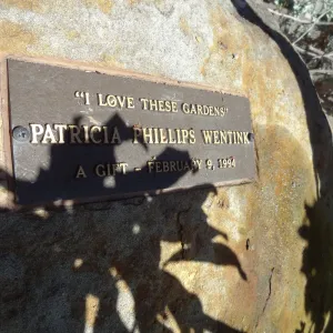 Memorial plaque on sandstone boulder, at Garden entrance
