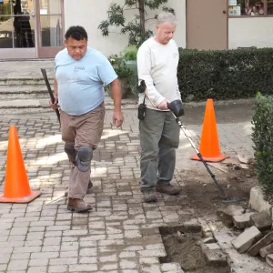 Working to repair broken water pipe in Courtyard