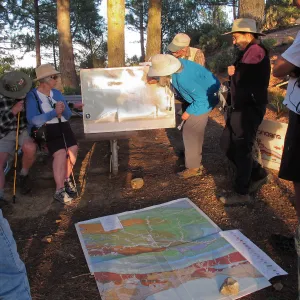 La Cumbre Peak: Sunset on the Sandstone day trip, Susie Bartz draws in the major faults on a map of Southern California to explain of the geologic history of Santa Barbara County 