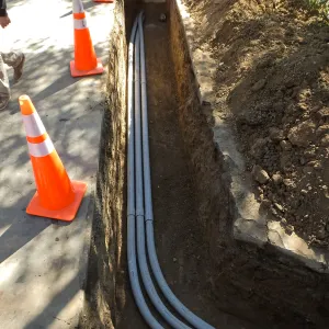 Power and data conduit being installed in the Arroyo Section