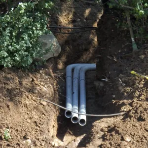 Power and data conduit being installed in the Arroyo Section