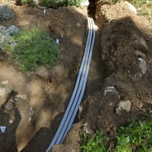 Power and data conduit being installed in the Arroyo Section