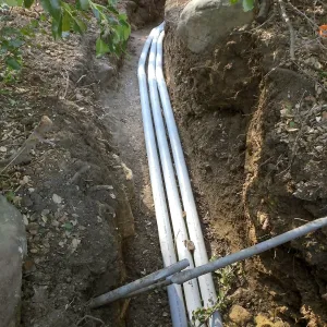 Power and data conduit being installed in the Arroyo Section