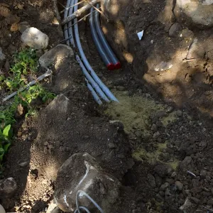 Power and data conduit being installed in the Arroyo Section