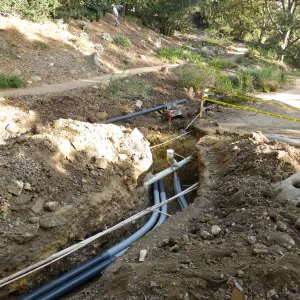 Power and data conduit being installed in the Arroyo Section