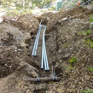 Power and data conduit being installed in the Arroyo Section