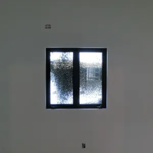 Pritzlaff Conservation Center Construction, stucco overspray patterns outside windows