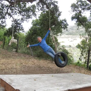 Santa Cruz Island Trip, Diana Blanchard swinging on tire swing at UC Research Station