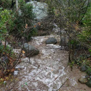 Mission Creek and Lassiter Boulder during rainstorm