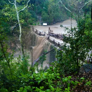 Mission Creek cresting Mission Dam during rainstorm