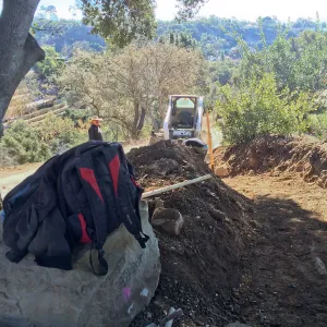 Construction of drainage culvert southeast corner of upper parking lot.