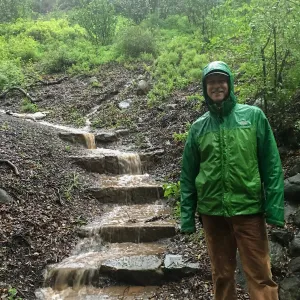 Water flowing down Woodland Trail steps during rainstorm