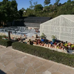 Repaired Lath House and new steel plant benches in the Garden Growers Nursery