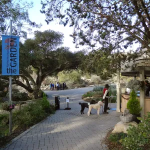 Garden Entrance, Entrance kiosk, visitor with dogs on leash
