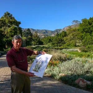 Patick O'Hara with his painting â€œIris and Lilyâ€