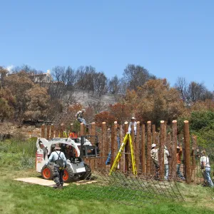 Construction of Herb Parker's â€˜Haven' labyrinth, placing roof structure