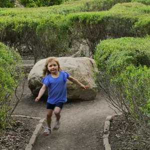 Child running through the Centennial Maze