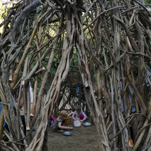 Santa Barbara Botanic Garden Casitas Opening, children playing in the â€œWoodrat Houseâ€ Casita