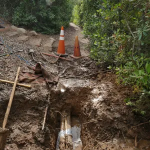 Broken 4 inch irrigation water pipe in Porter Trail section, looking south