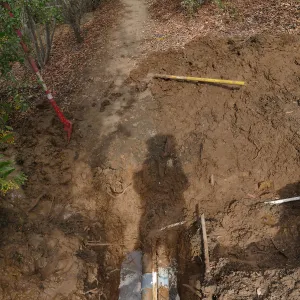 Broken 4 inch irrigation water pipe in Porter Trail section, looking north