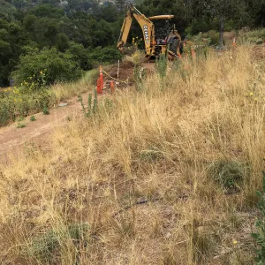 Fixing leaking water line on west PCC slope