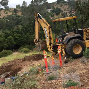 Fixing leaking water line on west PCC slope