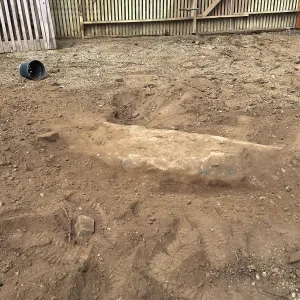Repair of Garden Growers Lath House. Boulders to remove, looking west