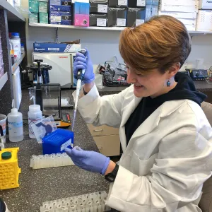 Emily Thomas working in the genetics lab