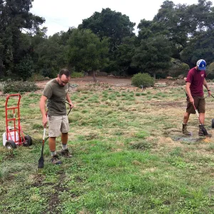 Using propane torches to kill weed seedlings in the Meadow
