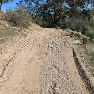 Gravel treatment to cart trail on west side of PCC