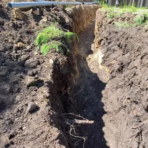 Trenching at Hansen site for communications and electrical lines