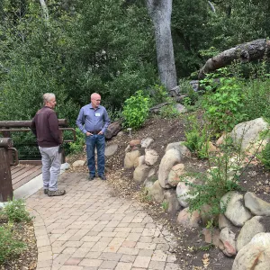 Dave Kershaw & Steve Windhager examine rock wall to be rebuilt at Campbell Bridge