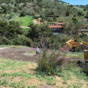 Chip sealing service road on East Slope of Garden